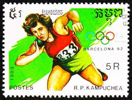 MOSCOW, RUSSIA - OCTOBER 29, 2022: Postage stamp printed in Cambodia shows Shot Put, Summer Olympic Games 1992 - Barcelona (I) serie, circa 1989
