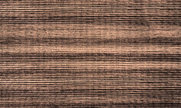 The background texture is a close-up brown striped image
