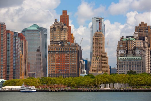 New York, USA - July 9, 2010: view to skyline of New York with battery park at a cloudy day.