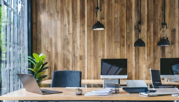 Modern office interior with blank wooden wall.