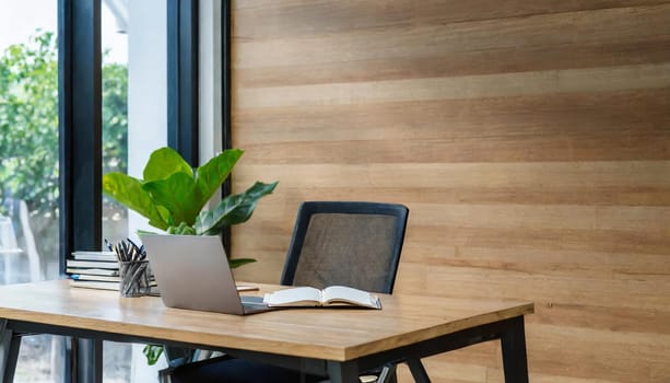 Modern office interior with blank wooden wall.