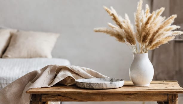 modern white ceramic vase with dry lagurus ovatus grass and marble tray on vintage wooden bench table blurred beige linen blanket in front scandinavian interior empty white wall copy space