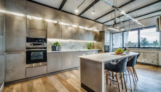 Cozy studio apartment with inviting interior featuring a comfortable brown sofa curtains and a cream colored kitchen with an island
