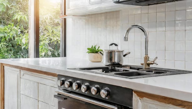 Contemporary kitchen with white countertop, gas stove, and sink.