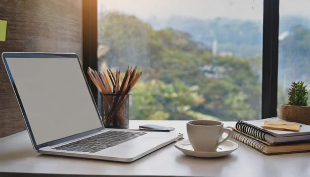 Modern workplace with laptop computer, coffee cup and office supplies
