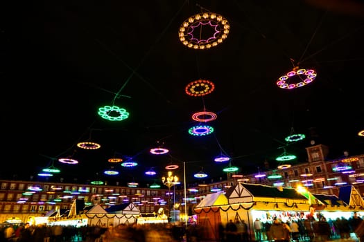 Madrid, Spain - December 20, 2010: christmas time at plaza de mayor in madrid in the night with illuminated stars