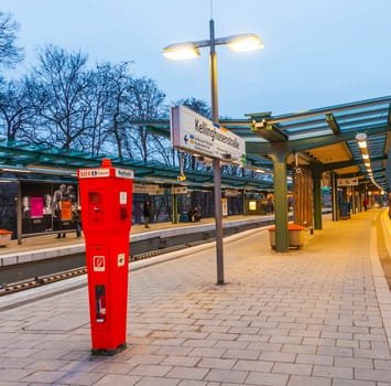 Hamburg, Germany - January 20, 2011: Metro Station Kellinghusen Strasse at night in Hamburg, Germany. The station is protected by a SOS telephone  phone with police connection.