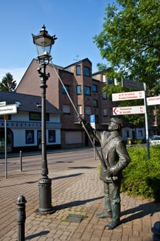 Willich, Germany - June 3, 2011: statue for the historic figure of the lateerepit, the man who lights up the laterns in the evening  in former times