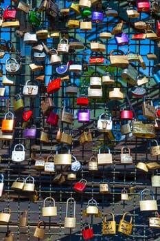 Cologne, Germany - May 29, 2011: lockers at the  Hohenzollern bridge symbolize love for ever in Cologne, Germany. It is the most heavily used railway bridge in Germany and used by pedestrians in love.