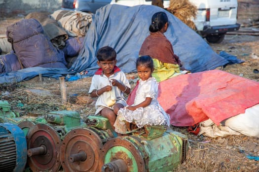 New Delhi, India - November 10, 2011:  portrait of young woman with child on arm  at  Meena Bazaar Market in Delhi, India. Shah Jahan founded the bazaar in the 17th century.