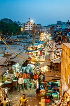 Delhi, India - November 10, 2011: people in the evening at the Meena Bazaar Market  in Delhi, India. Shah Jahan founded the bazaar in the 17th century inspired by the Isfahan Bazaar.