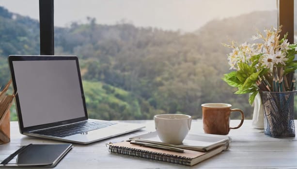Modern workplace with laptop computer, coffee cup and office supplies