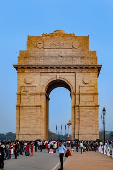 Delhi, India - November 13, 2011: people visit famous india gate in Delhi.