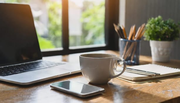 Wood office desk table with a lot of things tablet, laptop ,smartphone ,notepad and coffee cup notepad .copy space virtual interface icons screen.