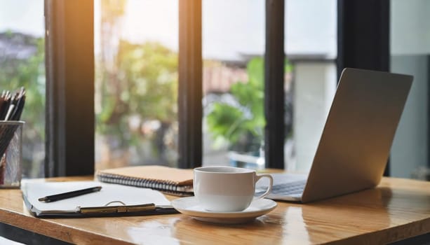 Wood office desk table with a lot of things tablet, laptop ,smartphone ,notepad and coffee cup notepad .copy space virtual interface icons screen.