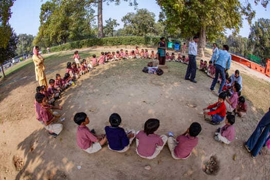 New Delhi, India - November 17, 2011: children at india gate in school uniform have an excursion organized by the school to visit india gate.