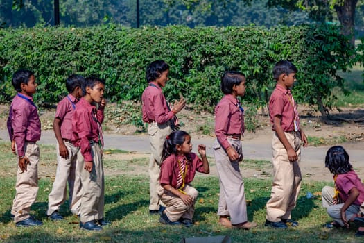 New Delhi, India - November 17, 2011: children at india gate in school uniform have an excursion organized by the school to visit india gate.