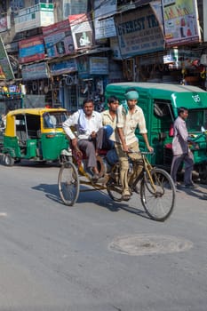New Delhi, India - November 17, 2011: streetlife at oldest market Chandni Chowk in old Delhi. People carrying goods, sell goods and carrying goods  at Meena Bazaar in Chandni Chowk