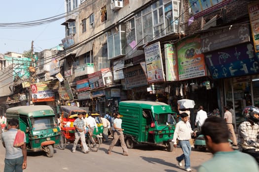 New Delhi, India - November 17, 2011: streetlife at oldest market Chandni Chowk in old Delhi. People carrying goods, sell goods and carrying goods  at Meena Bazaar in Chandni Chowk