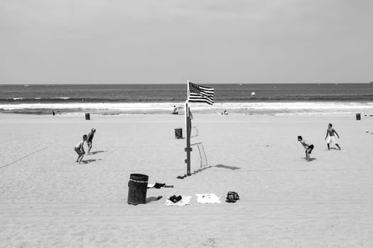 Redondo Beach, USA - June 6, 2012: people enjoy playing Volleyball at the fine sandy beach at Redondo Beach near Los Angeles.
