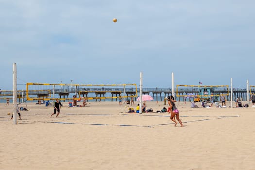 Redondo Beach - USA - June 6, 2012: people enjoy playing Volleyball at the fine sandy beach at Redondo Beach near Los Angeles.