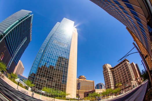 Phoenix, USA - June 14, 2012:  perspective of skyscrapers downtown at central avenue in Phoenix. Central Avenue represents almost every architectural use and style found in Phoenix.