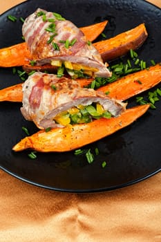 Roast pork meat roll and baked sweet potatoes.