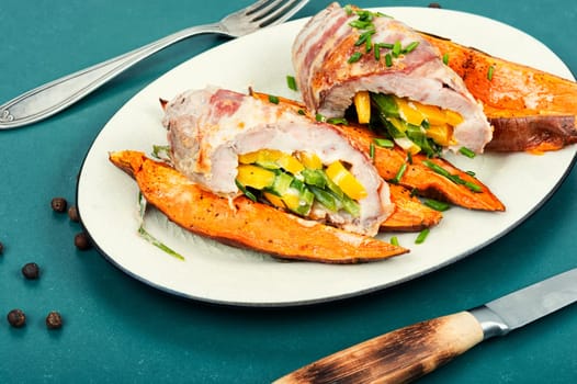Roast pork meat roll and baked sweet potatoes.
