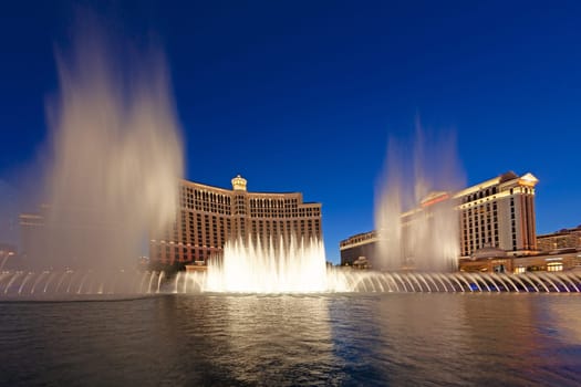 LAS VEGAS, USA - JUNE 15, 2012: Las Vegas Bellagio Hotel Casino, featured with its world famous fountain show, at night with fountains in Las Vegas, Nevada.