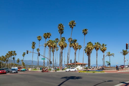 Santa Barbara, USA - June 23, 2012: scenic view to beach promenade with alley of palm trees in Santa Barbara, USA.
