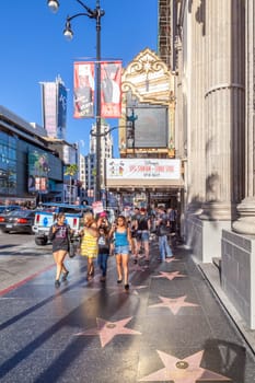 Los Angeles, USA - June 24, 2012: people promenade at the Hollywood boulevard at the walk of fame with thousands of stars from famous Hollywood legends.