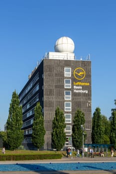 Hamburg, Germany - July 24, 2012: old building in the technical area at the Lufthansa Base in Hamburg, Germany with an old telecommunication ball and antenna.
