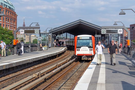 Hamburg, Germany - July 25, 2012: people enter the train at Baumwall U-Bahn Station in Hamburg. Hamburg U-Bahn (Metro Rapid Transit System) was opened in 1912 and comprises four lines with a length of 105 km in 2012.