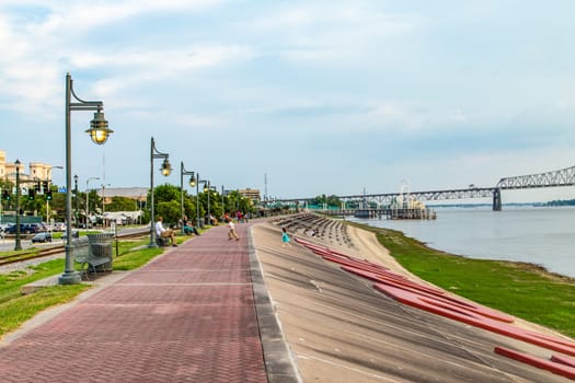 Baton Rouge, USA - July 13, 2013: people enjoy sitting at Mississippi promenade in Baton Rouge in the afternoon.