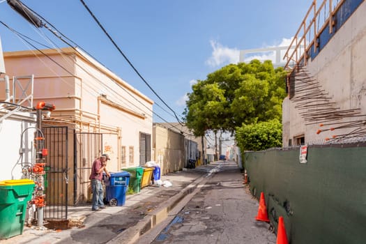 Mimi Beach, USA - August 5, 2013: small street with old buildings in the art deco district in Miami, USA.