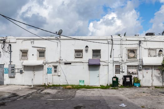 Mimi Beach, USA - August 5, 2013: small street with old buildings in the art deco district in Miami, USA.