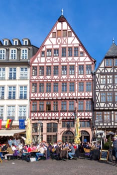 Frankfurt, Germany - March 29 2014: people enjoy visiting the roemer with its old half timbered houses in the opd town of Frankfurt.
