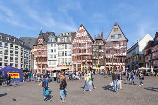 Frankfurt, Germany - March 29 2014: people enjoy visiting the roemer with its old half timbered houses in the opd town of Frankfurt.