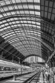 Frankfurt, Germany - May 16, 2014: Inside the Frankfurt central station in Frankfurt, Germany. People hurry to the intercity high speed train.