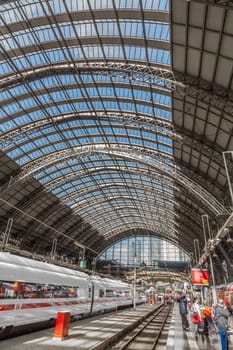 Frankfurt, Germany - May 16, 2014: Inside the Frankfurt central station in Frankfurt, Germany. People hurry to the intercity high speed train.