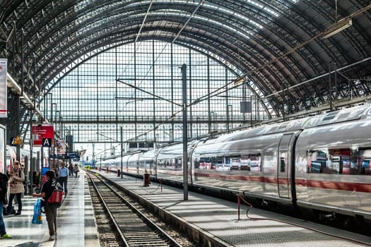 Frankfurt, Germany - May 16, 2014: Inside the Frankfurt central station in Frankfurt, Germany. People hurry to the intercity high speed train.