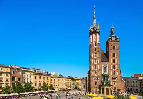Krakow, Poland - May 4, 2014: Mariacki church, Church of Our Lady Assumed into Heaven, a brick gothic church adjacent to the Main Market Square in Krakow, Poland.