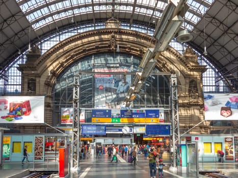 Frankfurt, Germany - May 17, 2014: Inside the Frankfurt central station in Frankfurt, Germany. With about 350.000 passengers per day its the most frequented railway station in Germany.