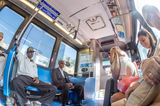 MIAMI, USA - AUG 18, 2014: people in the downtown Metro bus in Miami, USA. Metrobus operates more than 90 routes with close to 1,000 buses covering 41 million miles per year.