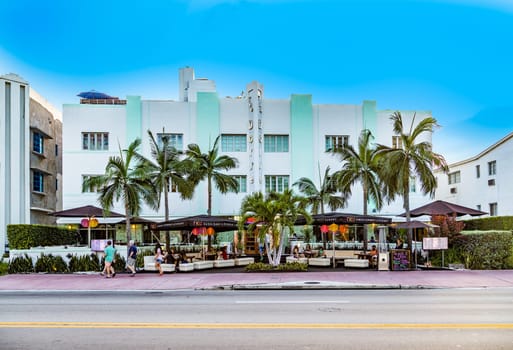 MIAMI, USA - AUG 18, 2014. People enjoy the outdoor restaurant at the art deco Hotel the Dorset in Miami in the art deco district at South Beach.
