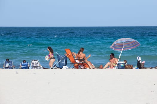 Miami Beach, USA - August 23, 2014: people enjoy the sunny day at south beach in Miami, USA.
