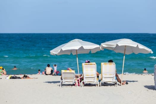 Miami Beach, USA - August 23, 2014: people enjoy the sunny day at south beach in Miami, USA.