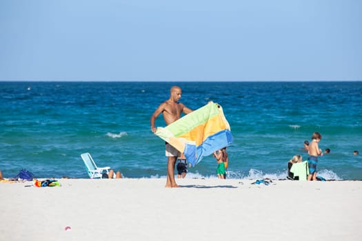 Miami Beach, USA - August 23, 2014: people enjoy the sunny day at south beach in Miami , USA.