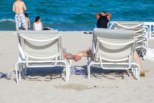 Miami Beach, USA - August 23, 2014: people enjoy the sunny day at south beach in Miami , USA.