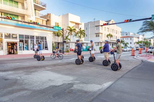 Miami, USA - August 23, 2014: tourists explore the art deco district in South Beach, Miami, USA, by Segway.
